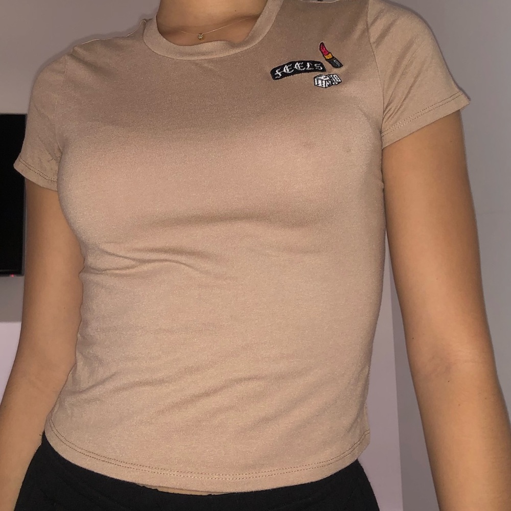 Tan “Feels” shirt with patchwork
